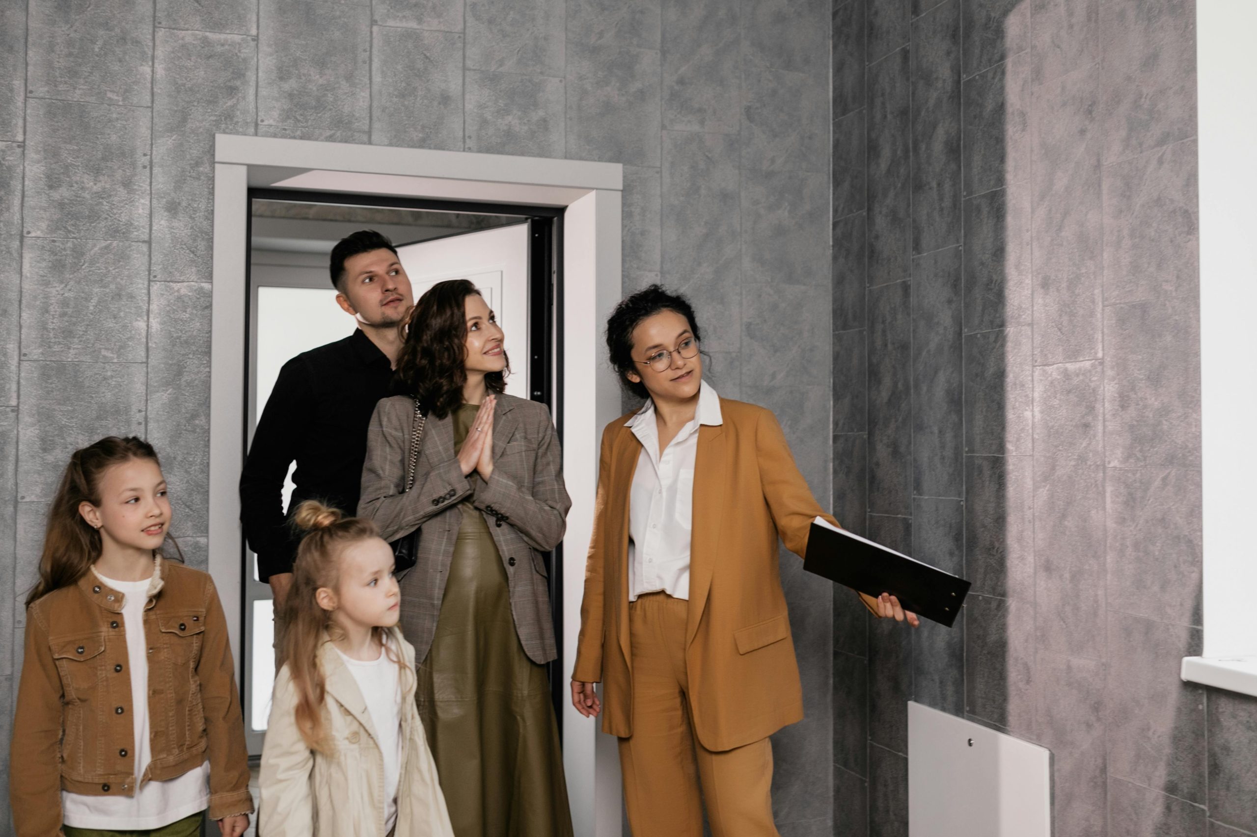 real estate agent and family during a house viewing
